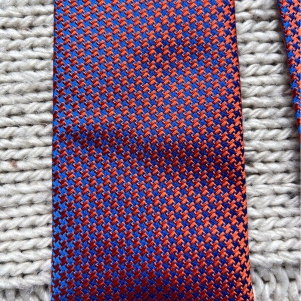 Seaword and stern “ The English Silk Tie” in orange and blue.